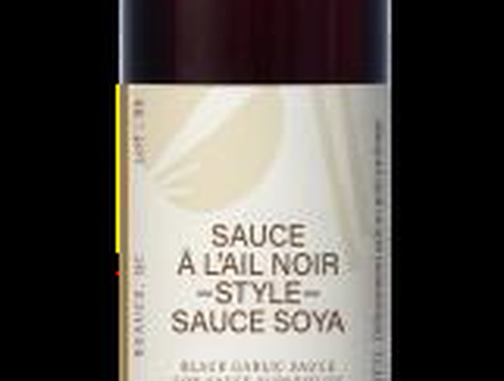 This is a bottle of black garlic-style soy sauce, offering a rich, savory flavor.