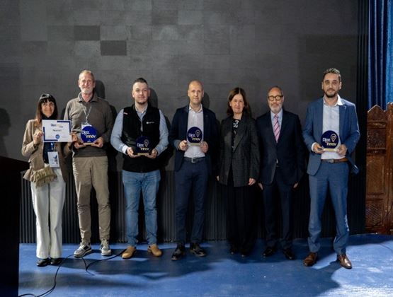 Award winners posing with their trophies and certificates during a Diazz’innov prize ceremony.