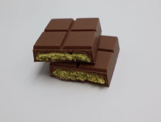 Two pieces of milk chocolate filled with a thick green pistachio and crispy pastry centre.