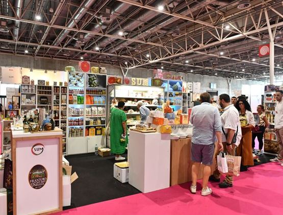 People at a stand in Gourmet Selection