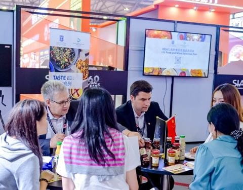 Food industry professionals engaging in a B2B meeting at SIAL Shanghai