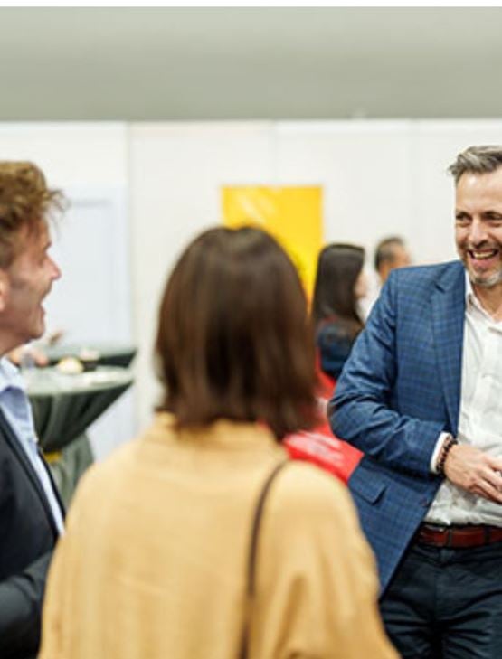 Business professionals networking at a B2B event with informal meetings and discussions