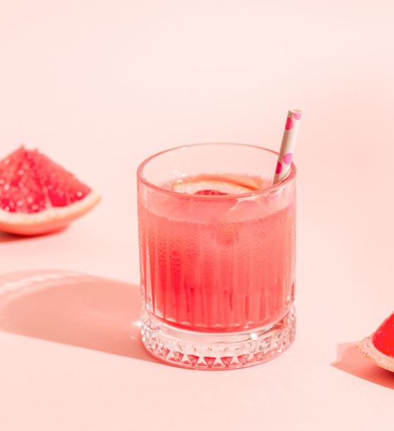 Pink iced grapefruit drink glass