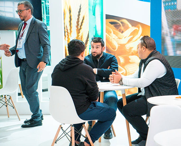 Visitors and exhibitors doing business on the show